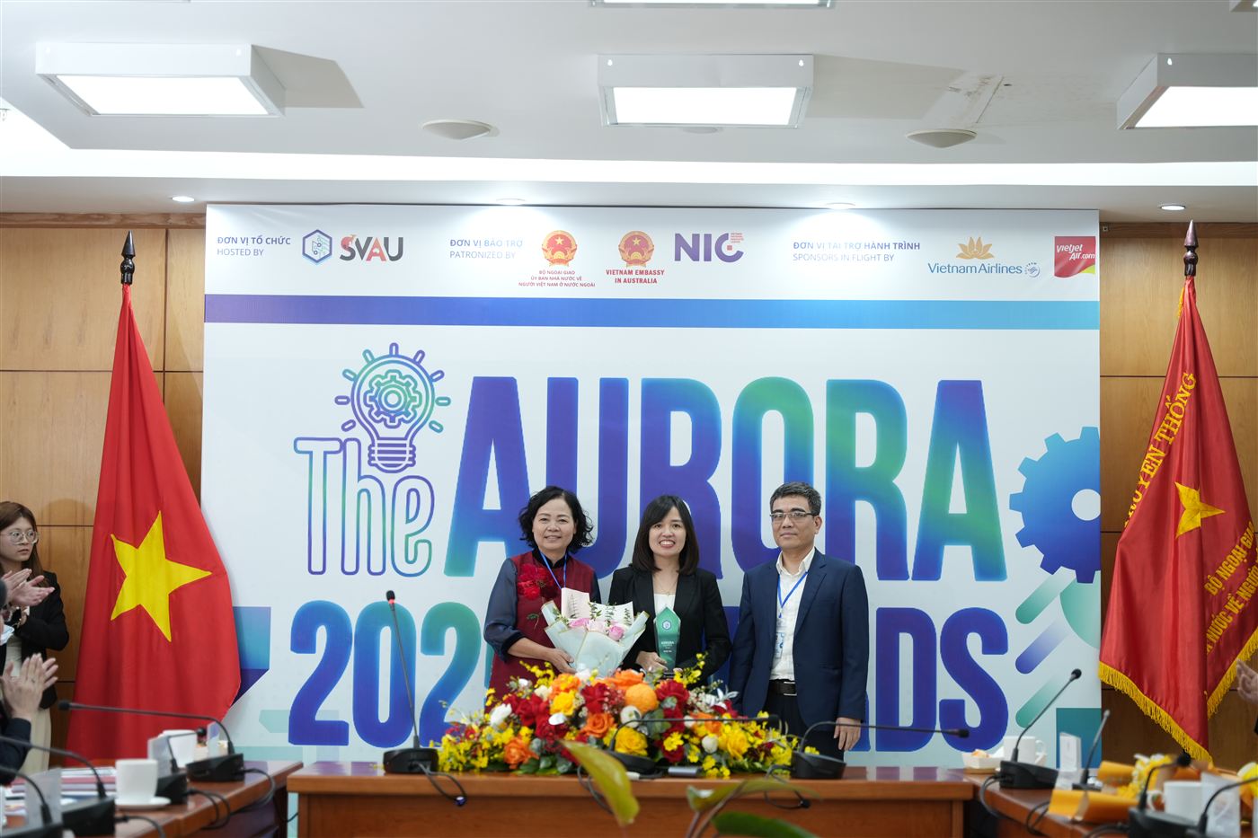 AURORA 2025 winners on stage with officials